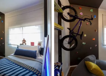 Neste dormitório, além das coleções de brinquedos e objetos, é possível ver uma parede de escalada e uma bicicleta suspensa, que traduzem a paixão do jovem por esportes / Projeto de Luciana Moreno e fotos de Tuca Reines