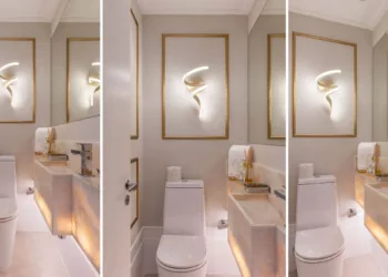 Neste lavabo, a arquiteta Cristiane Schiavoni uniu tons claros e materiais nobres, caso da bancada nesta 
pedra translúcida, que teve sua base iluminada. Entregando o clássico, a boiserie dourada enquadra a luminária tal qual uma obra de arte | Fotos: Rafael Renzo